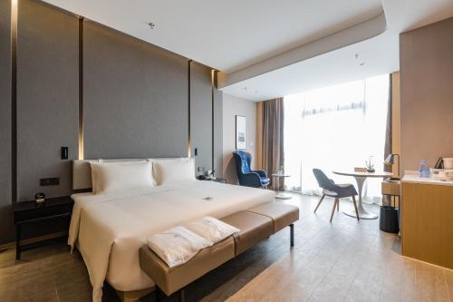 Imagen de la habitación del Hotel Atour Wuxi Coast City. Foto 14