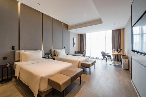 Imagen de la habitación del Hotel Atour Wuxi Coast City. Foto 15