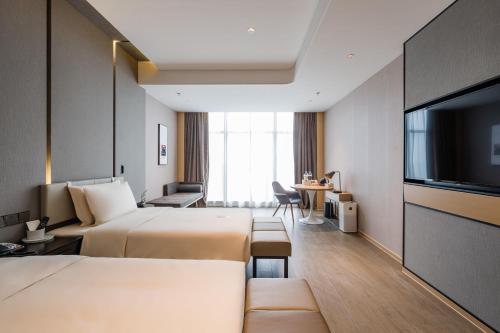 Imagen de la habitación del Hotel Atour Wuxi Coast City. Foto 17