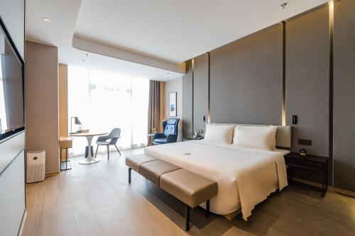 Imagen de la habitación del Hotel Atour Wuxi Coast City. Foto 18