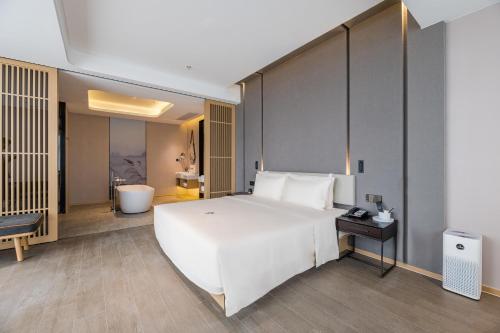 Imagen de la habitación del Hotel Atour Wuxi Coast City. Foto 19