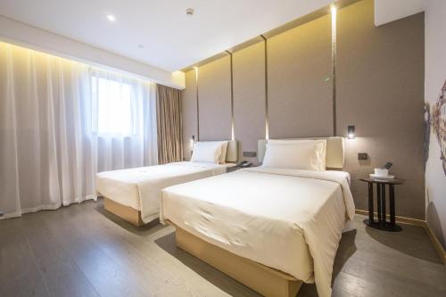 Imagen de la habitación del Hotel Atour Wuxi Railway Station Chunsheng Road. Foto 11