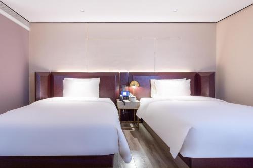 Imagen de la habitación del Hotel Atour X Haikou International Trade Center. Foto 10