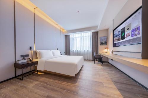 Imagen de la habitación del Hotel Atour X Haikou International Trade Center. Foto 11