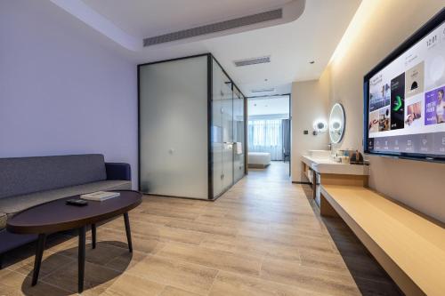 Imagen de la habitación del Hotel Atour X Haikou International Trade Center. Foto 13