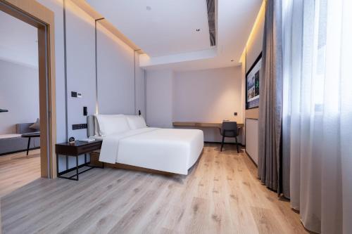 Imagen de la habitación del Hotel Atour X Haikou International Trade Center. Foto 16