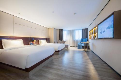 Imagen de la habitación del Hotel Atour X Haikou International Trade Center. Foto 17