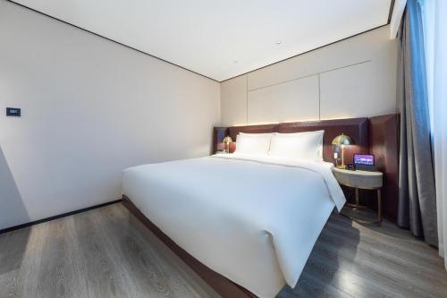 Imagen de la habitación del Hotel Atour X Haikou International Trade Center. Foto 19