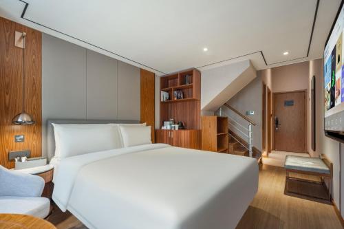 Imagen de la habitación del Hotel Atour X Shanghai Lujiazui Binjiang Avenue. Foto 12