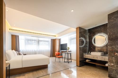 Imagen de la habitación del Hotel Atour X Taizhou Jiangyan. Foto 17