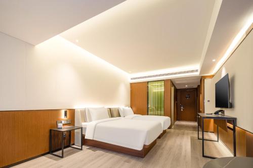 Imagen de la habitación del Hotel Atour X Taizhou Jiangyan. Foto 18