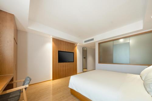Imagen de la habitación del Hotel Atour X Wuxi Binhu Sports Center. Foto 11