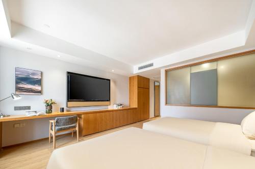 Imagen de la habitación del Hotel Atour X Wuxi Binhu Sports Center. Foto 13