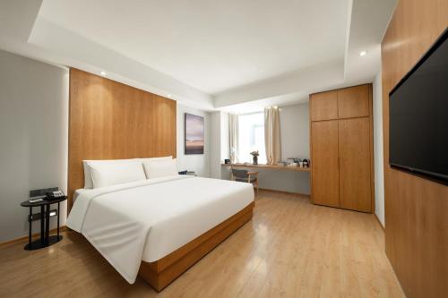 Imagen de la habitación del Hotel Atour X Wuxi Binhu Sports Center. Foto 15