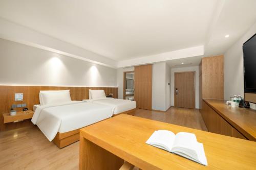 Imagen de la habitación del Hotel Atour X Wuxi Binhu Sports Center. Foto 18