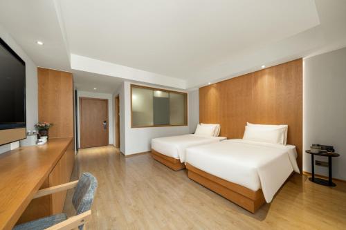 Imagen de la habitación del Hotel Atour X Wuxi Binhu Sports Center. Foto 19