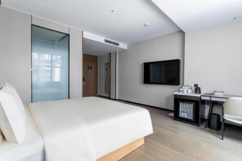 Imagen de la habitación del Hotel Atour X Zhuhai Gongbei Port High Speed Railway Station. Foto 13