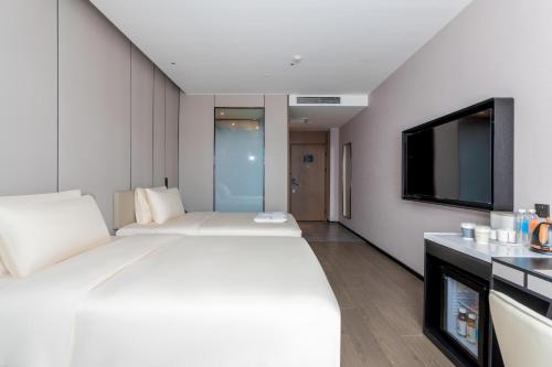 Imagen de la habitación del Hotel Atour X Zhuhai Gongbei Port High Speed Railway Station. Foto 18