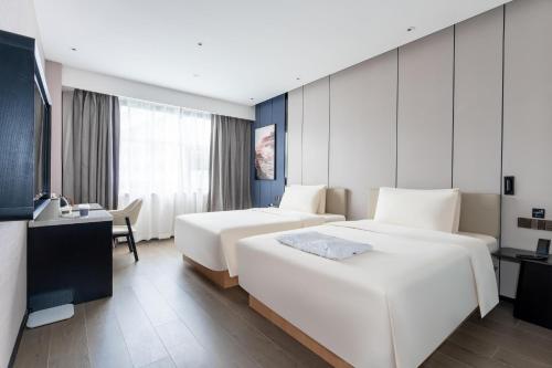 Imagen de la habitación del Hotel Atour X Zhuhai Gongbei Port High Speed Railway Station. Foto 20