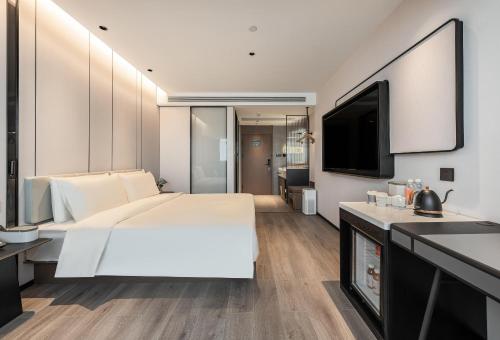 Imagen de la habitación del Hotel Atour Xiamen Gaoqi Airport Chenggong Avenue. Foto 12