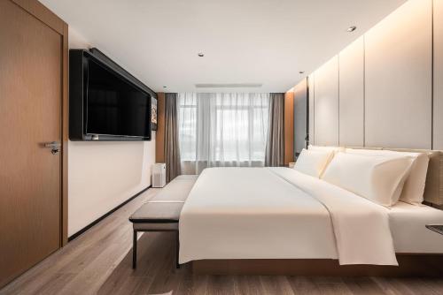 Imagen de la habitación del Hotel Atour Xiamen Gaoqi Airport Chenggong Avenue. Foto 13
