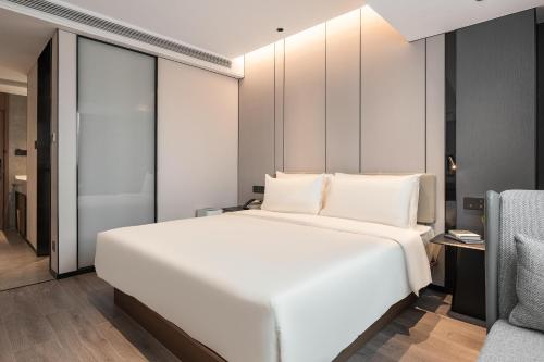 Imagen de la habitación del Hotel Atour Xiamen Gaoqi Airport Chenggong Avenue. Foto 14