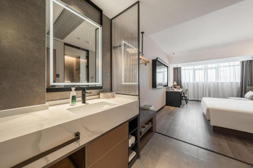 Imagen de la habitación del Hotel Atour Xiamen Gaoqi Airport Chenggong Avenue. Foto 17