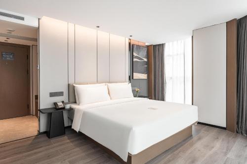 Imagen de la habitación del Hotel Atour Xiamen Gaoqi Airport Chenggong Avenue. Foto 18