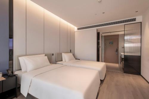 Imagen de la habitación del Hotel Atour Xiamen Huli Powerlong International. Foto 19