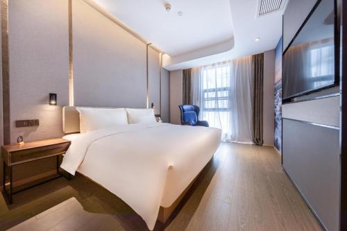 Imagen de la habitación del Hotel Atour Xiamen Jimei Lake Business Center. Foto 10
