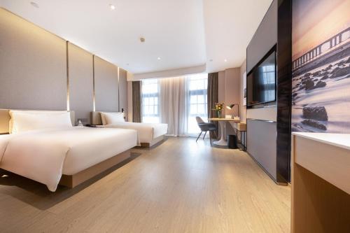 Imagen de la habitación del Hotel Atour Xiamen Jimei Lake Business Center. Foto 11