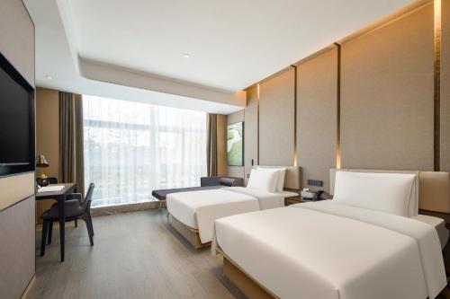 Imagen de la habitación del Hotel Atour Xiamen Meifeng Binhai Romantic Line. Foto 17