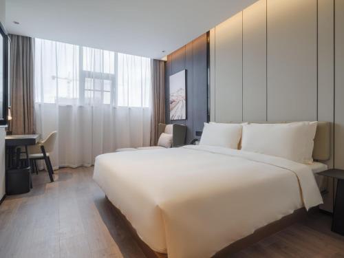 Imagen de la habitación del Hotel Atour Xiamen North Station Jiageng Stadium. Foto 17