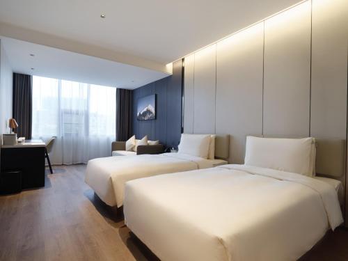 Imagen de la habitación del Hotel Atour Xiamen North Station Jiageng Stadium. Foto 18