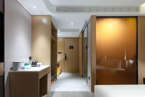 Imagen de la habitación del Hotel Atour Xiamen Wuyuanwan Wanda Plaza. Foto 7