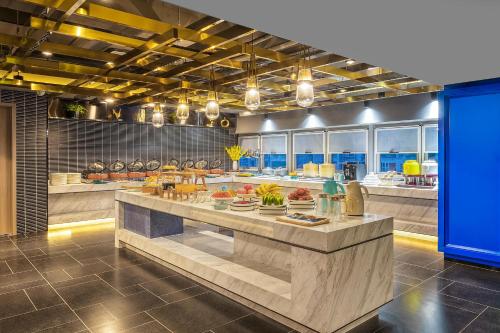 Imagen del bar/restaurante del Hotel Atour Xi\'an Daming Palace. Foto 8