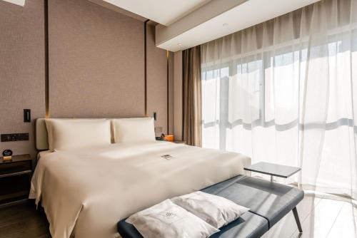 Imagen de la habitación del Hotel Atour Yixian Building Wujiaochang Shanghai. Foto 14