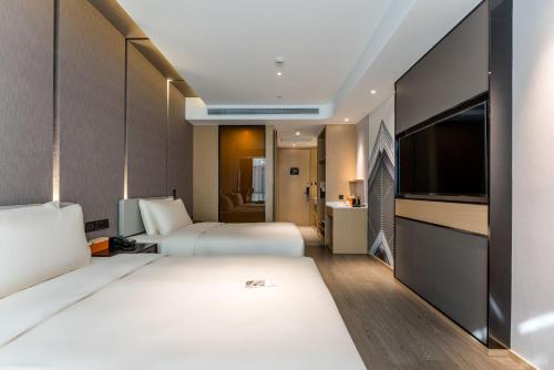 Imagen de la habitación del Hotel Atour Yixian Building Wujiaochang Shanghai. Foto 18