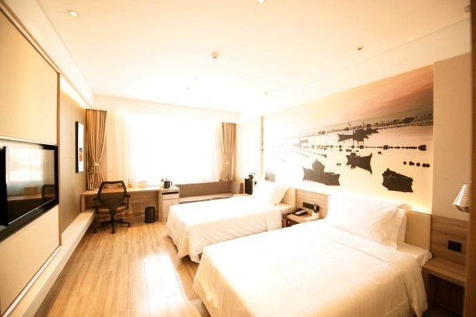 Imagen de la habitación del Hotel Atour Zhenda Road South Station Yantai. Foto 11