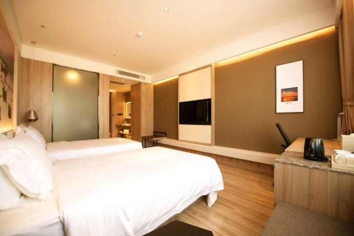 Imagen de la habitación del Hotel Atour Zhenda Road South Station Yantai. Foto 12