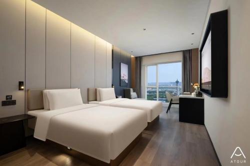 Imagen de la habitación del Hotel Atour Zhengzhou East Railway Station East Plaza. Foto 6