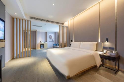 Imagen de la habitación del Hotel Atour Zhengzhou High-Tech Star Union. Foto 17