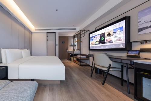 Imagen de la habitación del Hotel Atour Zhengzhou North Dragon Lake Financial Center. Foto 15
