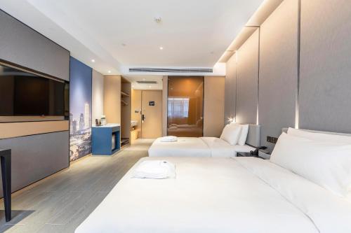 Imagen de la habitación del Hotel Atour Zhengzhou Xinzheng International Airport. Foto 12