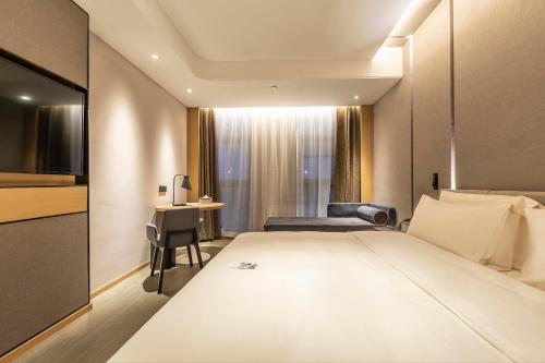Imagen de la habitación del Hotel Atour Zhengzhou Xinzheng International Airport. Foto 15