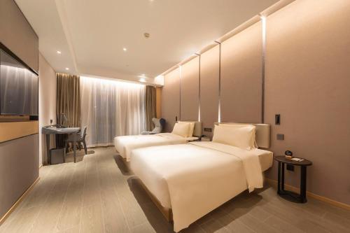 Imagen de la habitación del Hotel Atour Zhengzhou Xinzheng International Airport. Foto 17
