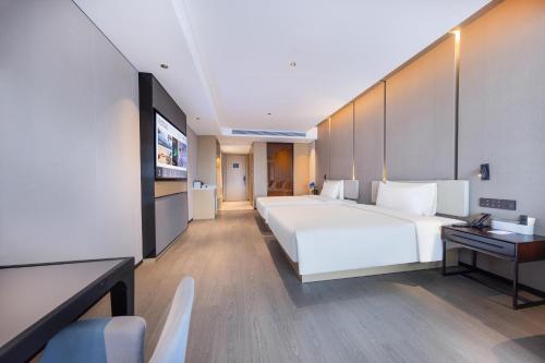 Imagen de la habitación del Hotel Atour Zhongshan Nantou Haiya Colorful City. Foto 13