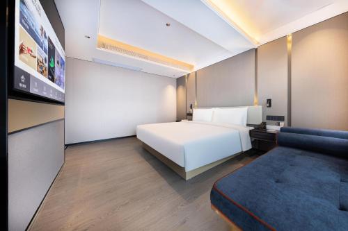Imagen de la habitación del Hotel Atour Zhongshan Nantou Haiya Colorful City. Foto 14