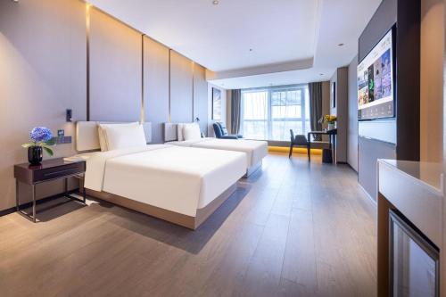 Imagen de la habitación del Hotel Atour Zhongshan Nantou Haiya Colorful City. Foto 16