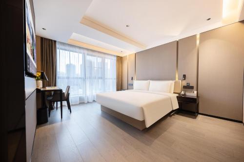 Imagen de la habitación del Hotel Atour Zhongshan Nantou Haiya Colorful City. Foto 17